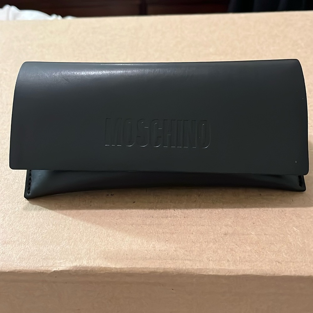 Authentic Moschino sunglasses with red small crystals outlining the frame